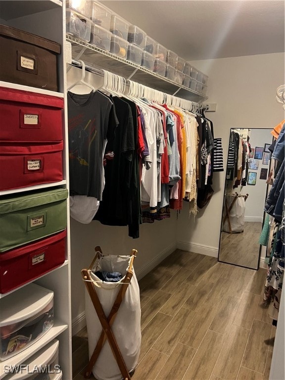 walk in closet featuring hardwood / wood-style floors