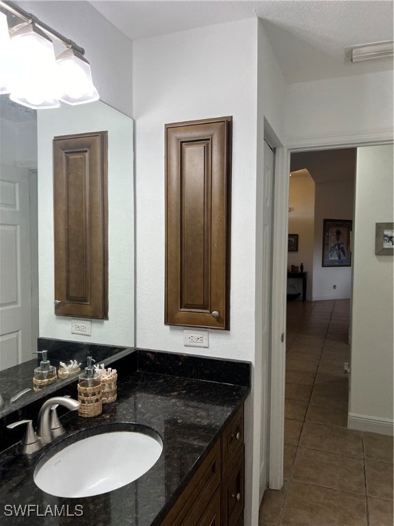 bathroom with vanity and tile patterned flooring