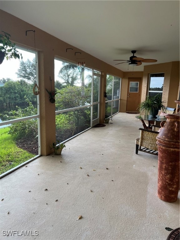 sunroom / solarium with ceiling fan