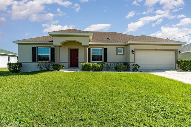 view of front of home with a garage and a front lawn