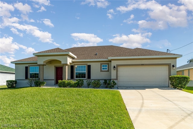 view of front of home featuring a front yard and a garage