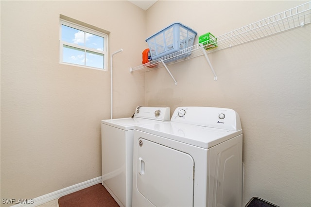 washroom with washing machine and dryer