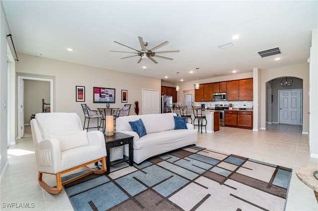 living room featuring ceiling fan and light tile patterned floors