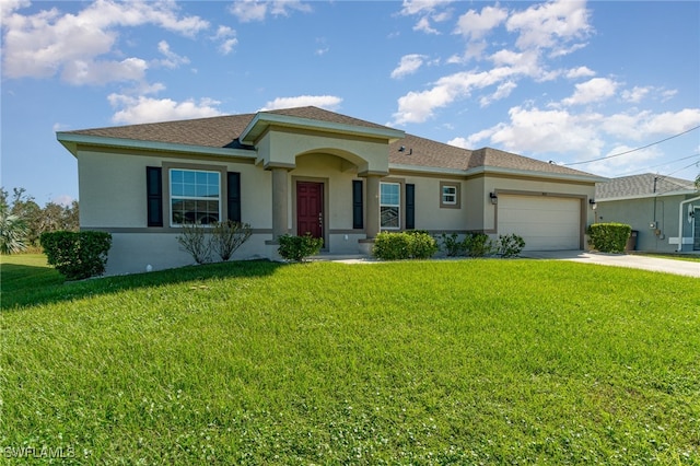 view of front of house with a garage and a front yard