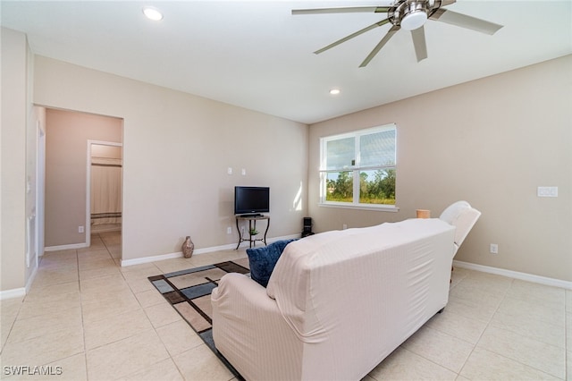 living room featuring ceiling fan and light tile patterned floors