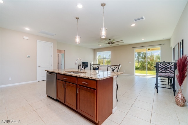 kitchen featuring a kitchen island with sink, ceiling fan, sink, light stone countertops, and stainless steel dishwasher