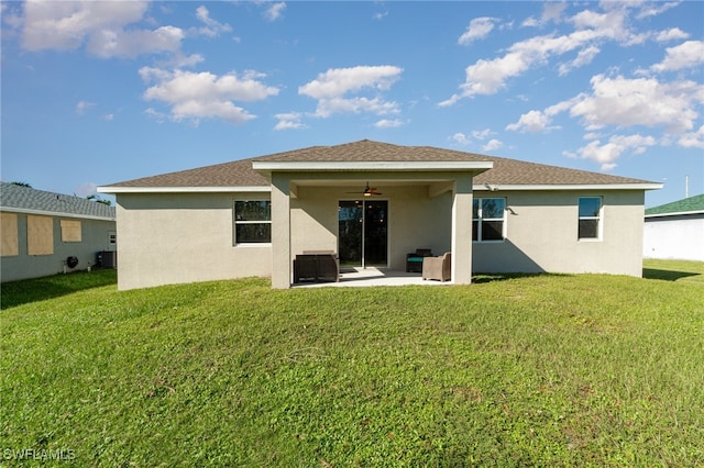 rear view of house with a yard, central AC, ceiling fan, and a patio