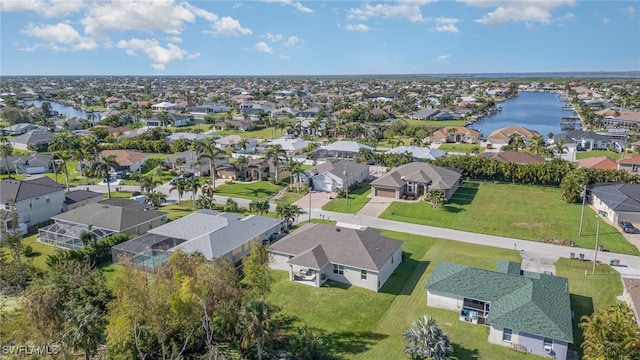 drone / aerial view with a water view