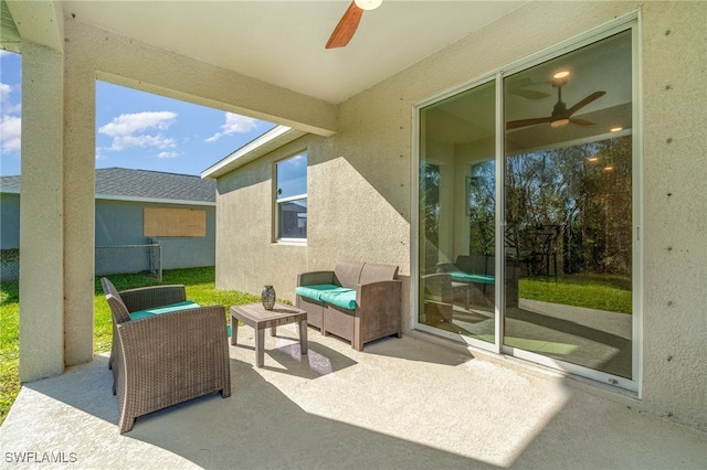 view of patio featuring an outdoor living space and ceiling fan