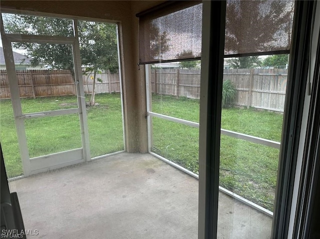 unfurnished sunroom with a wealth of natural light