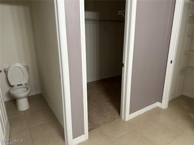 bathroom with tile patterned floors and toilet