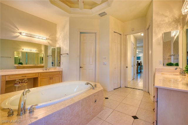 bathroom featuring vanity, ornamental molding, a relaxing tiled tub, and tile patterned flooring