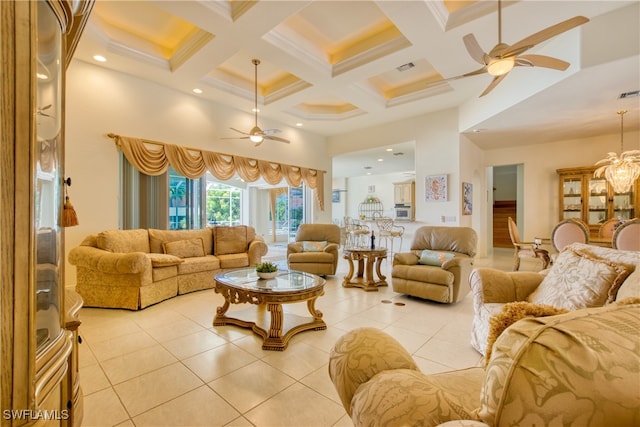 tiled living room featuring a towering ceiling, ceiling fan with notable chandelier, beamed ceiling, and coffered ceiling