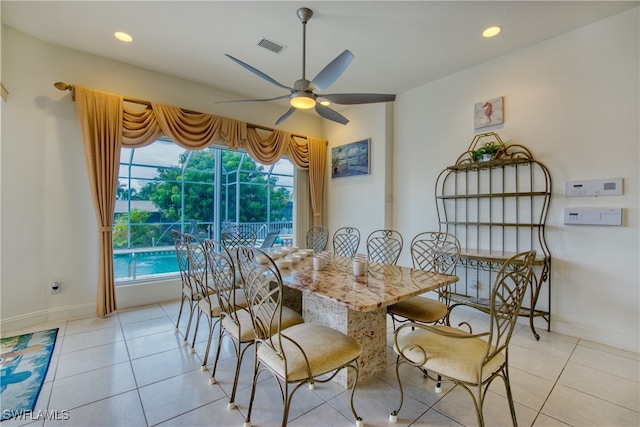 tiled dining room with ceiling fan