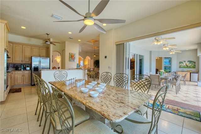 dining room with ceiling fan and light tile patterned floors