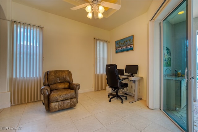 office area featuring ceiling fan and light tile patterned floors