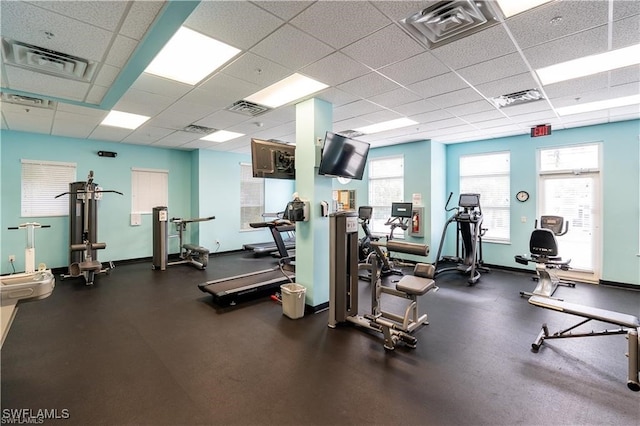 workout area featuring a paneled ceiling