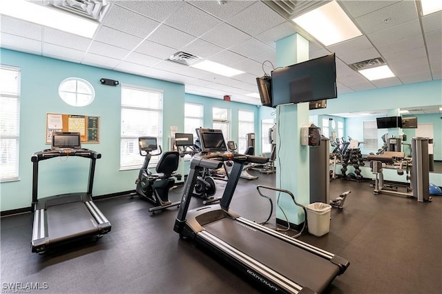 exercise room featuring a paneled ceiling