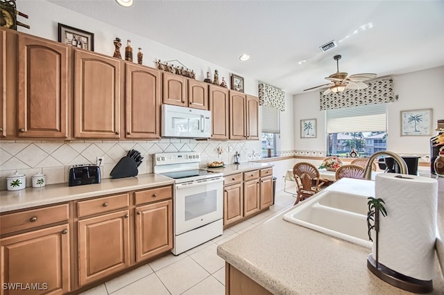 7831 Reflecting Pond Ct Unit 1821, Fort Myers, FL 33907 - kitchen featuring visible vents, decorative backsplash, white appliances, ceiling fan, and light tile patterned floors