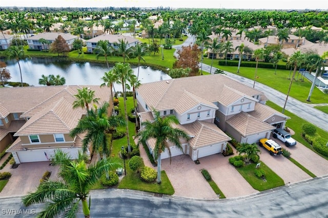 aerial view with a residential view and a water view