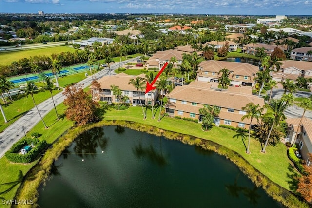 birds eye view of property featuring a residential view and a water view