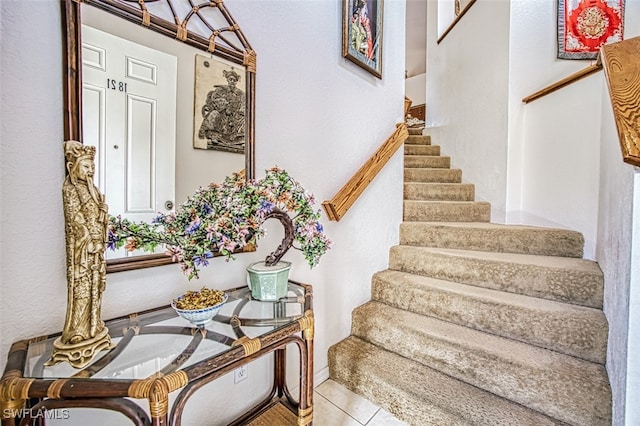 stairs with tile patterned floors