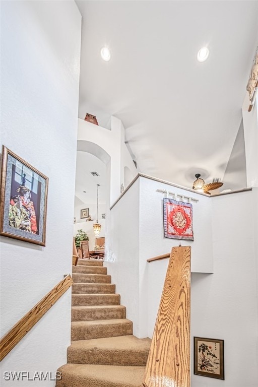 staircase with recessed lighting