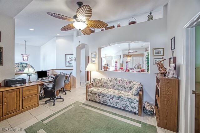 tiled office space featuring ceiling fan with notable chandelier