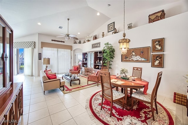 tiled dining room with lofted ceiling and ceiling fan