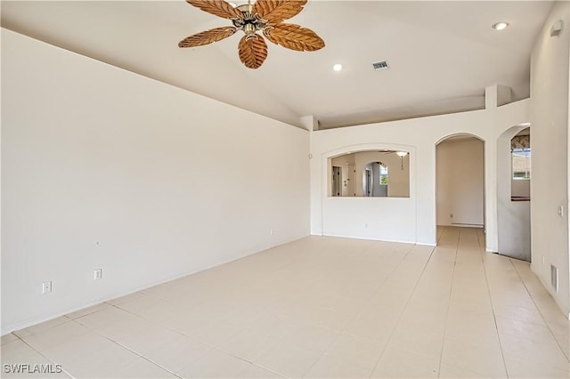 spare room featuring visible vents, ceiling fan, lofted ceiling, recessed lighting, and arched walkways