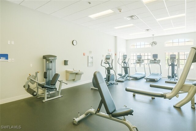 7831 Reflecting Pond Ct Unit 1821, Fort Myers, FL 33907 - workout area with visible vents, a drop ceiling, and baseboards