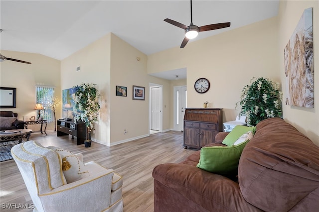 living room with ceiling fan, light hardwood / wood-style floors, and high vaulted ceiling