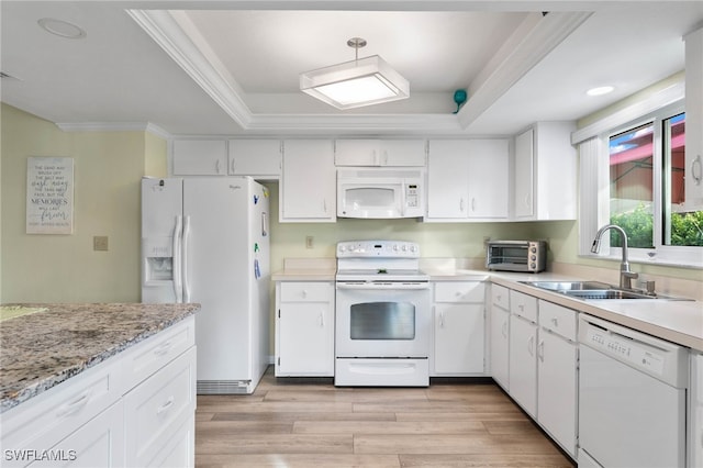 kitchen with white cabinets, white appliances, light hardwood / wood-style flooring, and sink