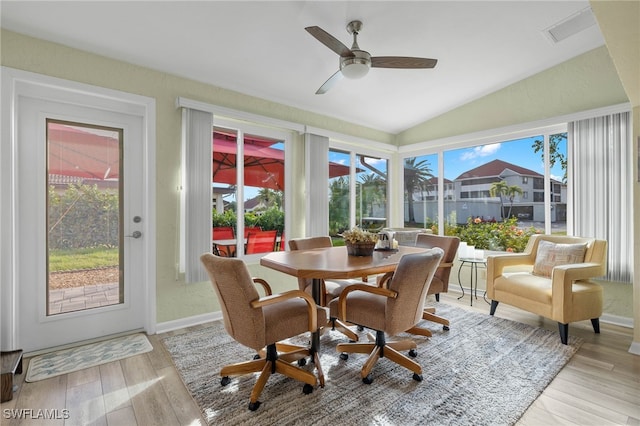 sunroom / solarium with a wealth of natural light, ceiling fan, and lofted ceiling