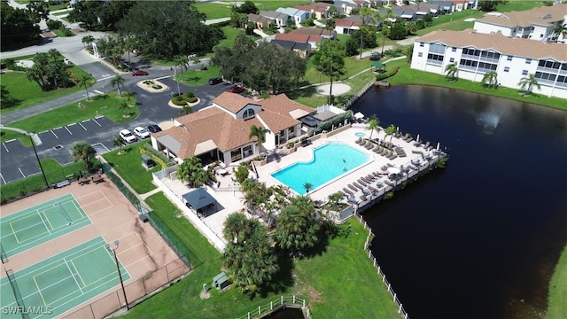 birds eye view of property with a water view