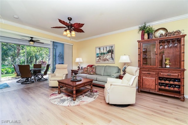 living room featuring ornamental molding and light wood-type flooring