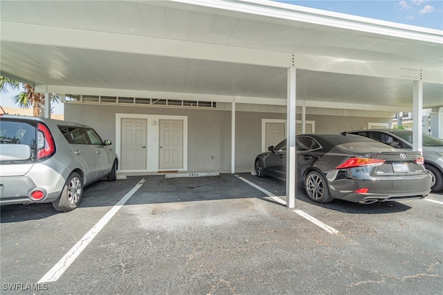 view of vehicle parking with a carport