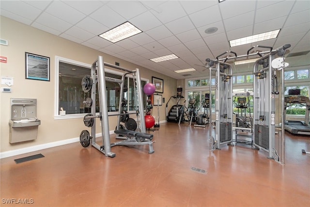 exercise room featuring a paneled ceiling