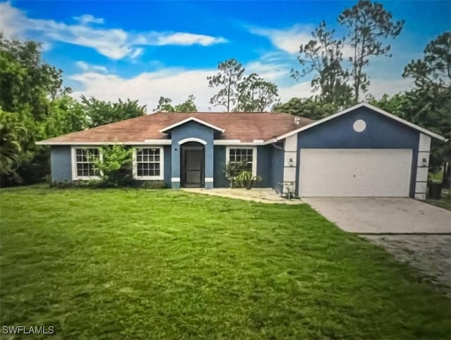 ranch-style house with a garage and a front lawn