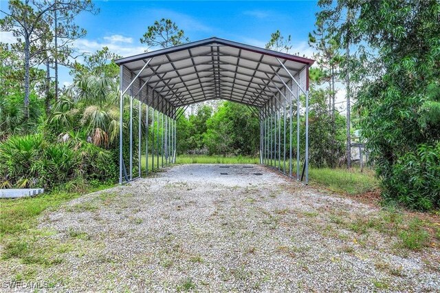 view of vehicle parking with a carport