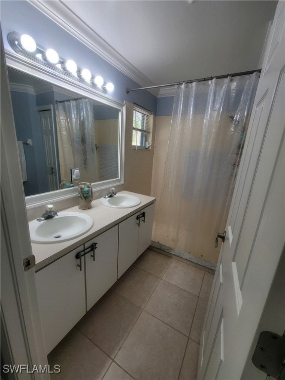 bathroom with ornamental molding, tile patterned floors, and vanity