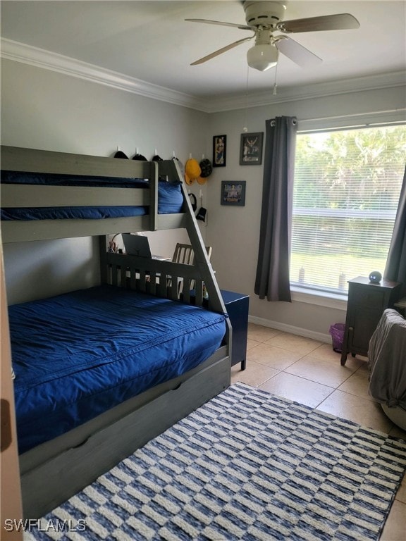 tiled bedroom featuring crown molding and ceiling fan