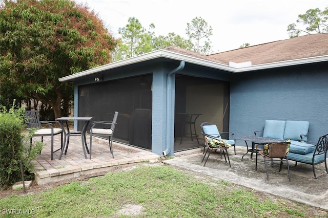 exterior space with outdoor lounge area and a patio