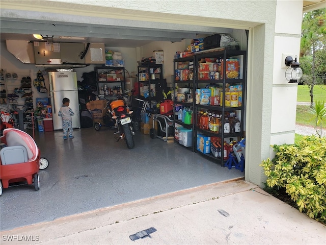 garage with white fridge