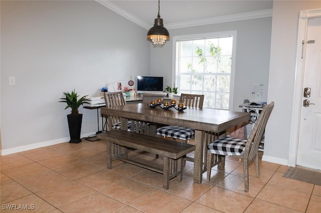 dining area featuring an inviting chandelier, crown molding, and light tile patterned flooring