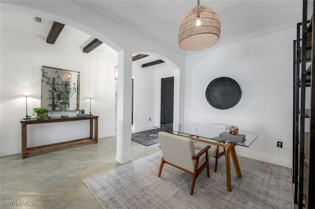 dining area featuring beam ceiling