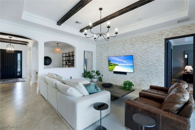 living room with beam ceiling, crown molding, an inviting chandelier, and light tile patterned floors