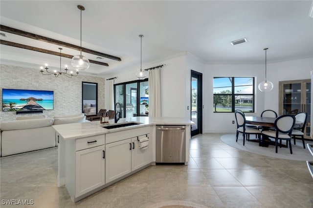 kitchen with white cabinets, a kitchen island with sink, stainless steel dishwasher, pendant lighting, and sink