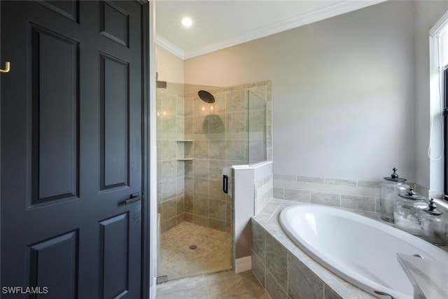 bathroom with tile patterned flooring, crown molding, and separate shower and tub