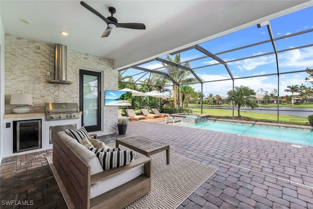 exterior space featuring a patio area, glass enclosure, grilling area, ceiling fan, and outdoor lounge area